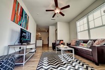 Riverfront-Village-Apartments-Near-University-of-Alabama-Living-Room-Kitchen