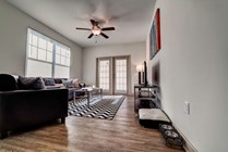 Riverfront-Village-Apartments-Near-University-of-Alabama-Living-Room-Windows