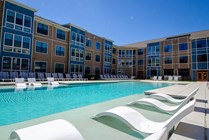 Riverfront-Village-Apartments-Near-University-of-Alabama-Lounge-Seating-Resort-Style-Pool
