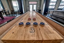 Riverfront-Village-Apartments-Near-University-of-Alabama-Resident-Clubhouse-Shuffleboard