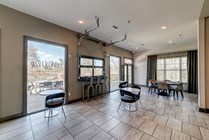 Riverfront-Village-Apartments-Near-University-of-Alabama-Seating-Resident-Clubhouse-Indoor-Outdoor